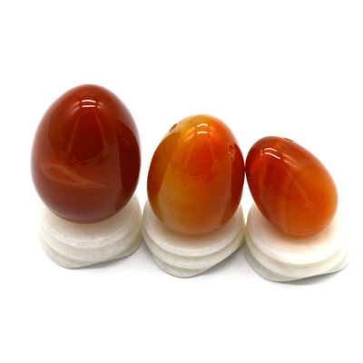 OEM ODM 받아 들인 적색 카넬리안 요니 달걀 반 귀석 달걀 뚫린 마사지 스타일