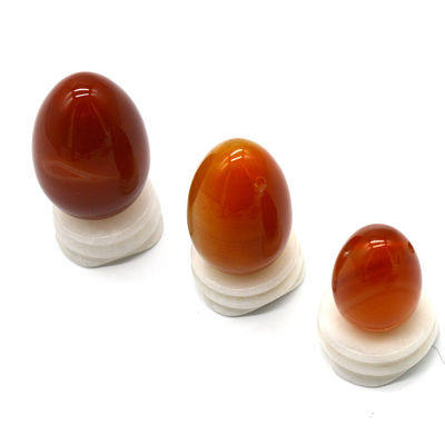 OEM ODM 받아 들인 적색 카넬리안 요니 달걀 반 귀석 달걀 뚫린 마사지 스타일