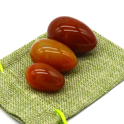 OEM ODM 받아 들인 적색 카넬리안 요니 달걀 반 귀석 달걀 뚫린 마사지 스타일