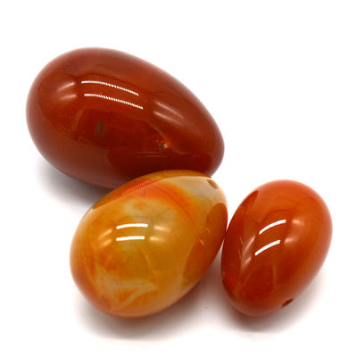 OEM ODM 받아 들인 적색 카넬리안 요니 달걀 반 귀석 달걀 뚫린 마사지 스타일