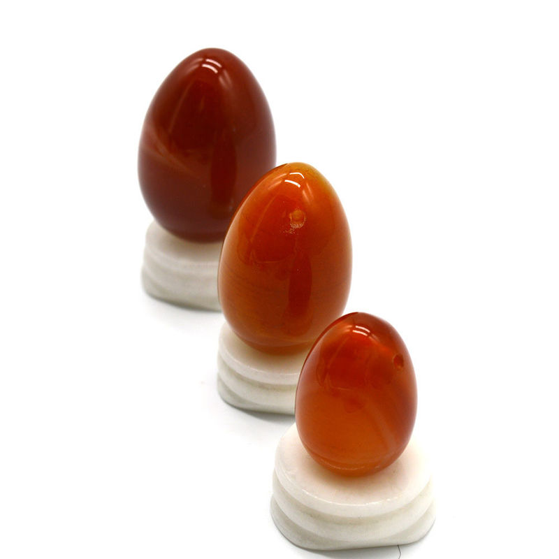 OEM ODM 받아 들인 적색 카넬리안 요니 달걀 반 귀석 달걀 뚫린 마사지 스타일